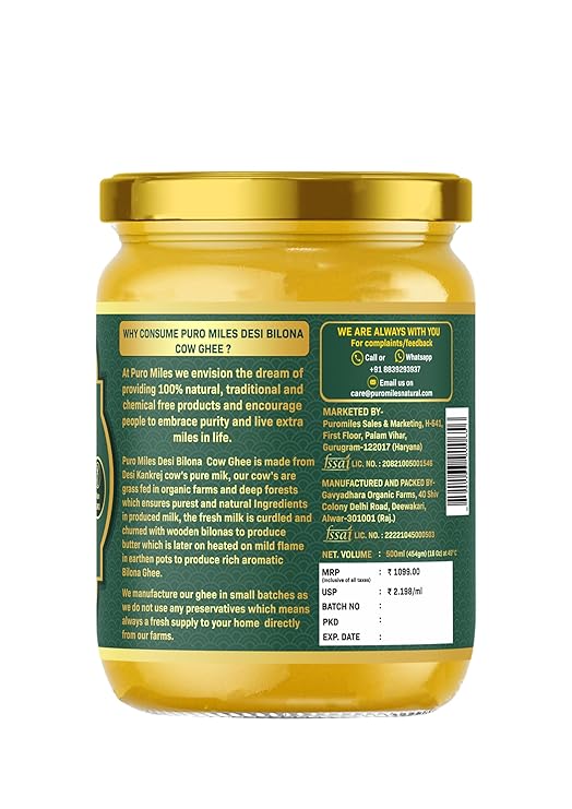 Jar of cow ghee with a green label on a white background
